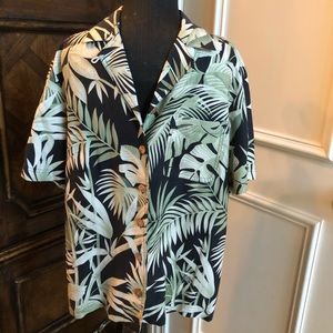 Kriss Kross Top. Island Colors Green/Cream Leaves on Black Background. Size 8